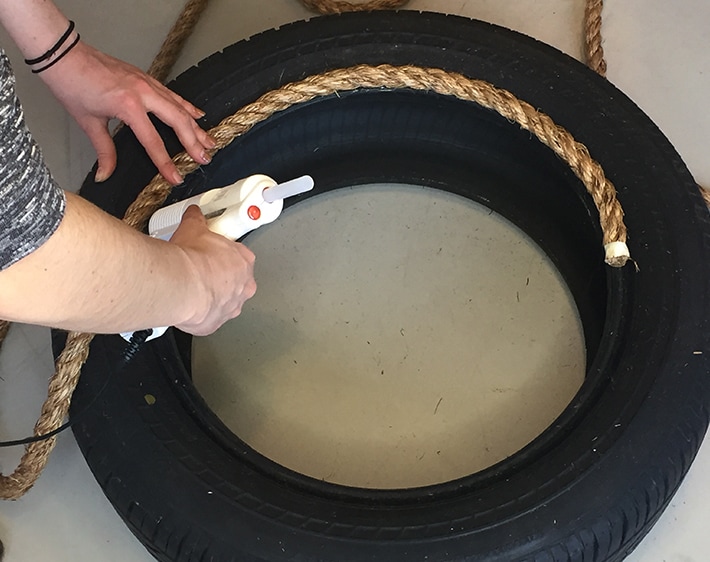 Step 2 - DIY Ottoman- Gluing rope around tire's top