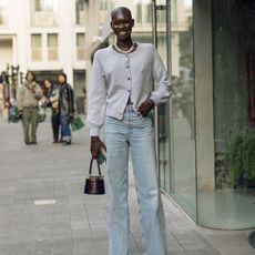 LFW street style- woman wearing cardigan and jeans