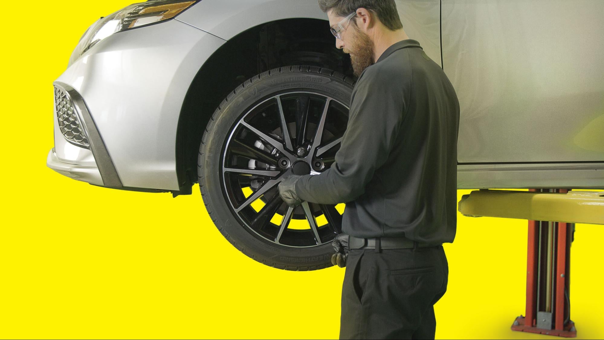 image of technician mounting tires